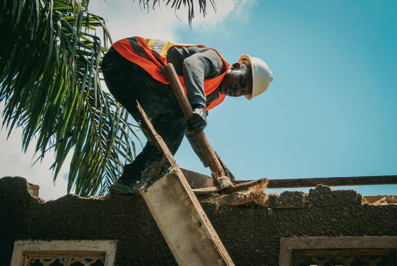 Ramusia team member screeding and finishing a concrete surface on site